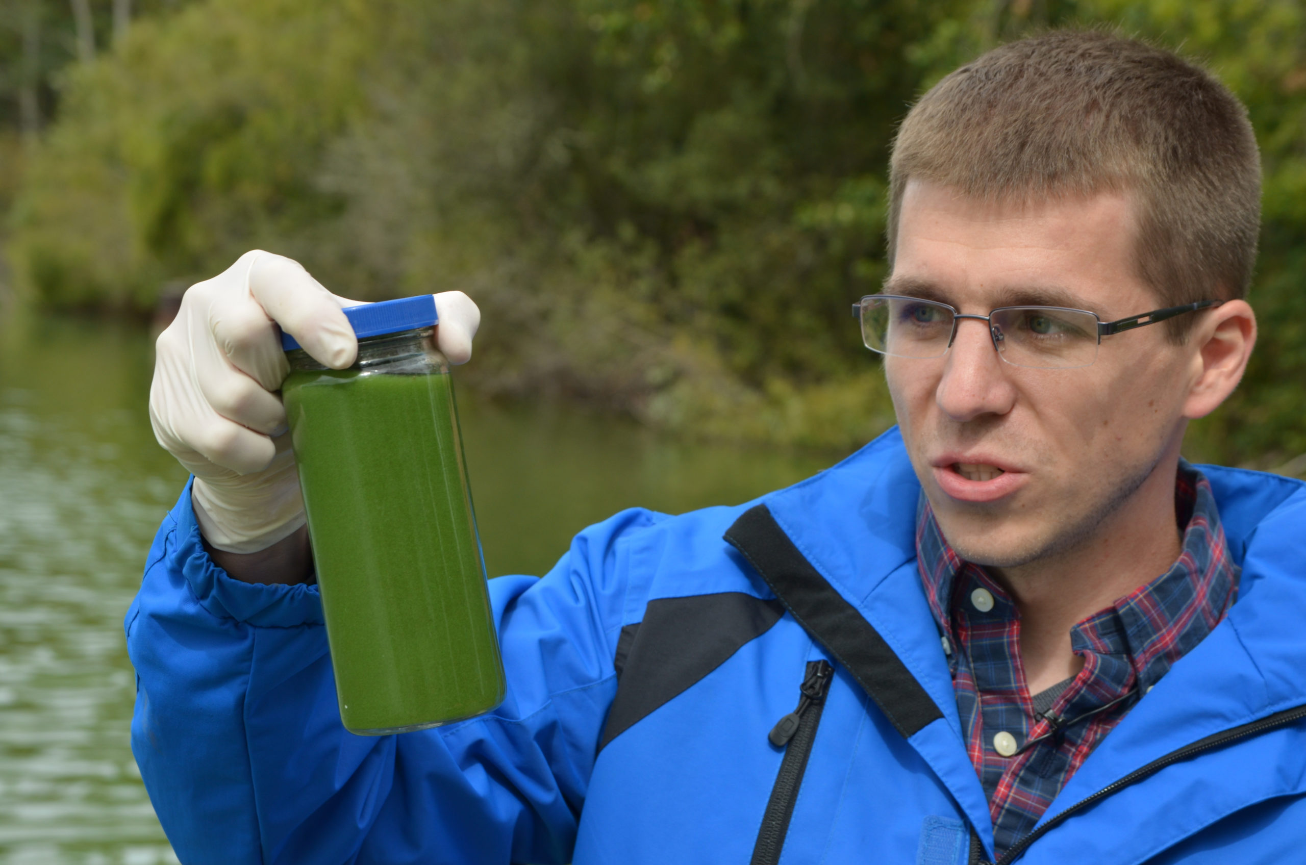 Officials sample algae at Waughop Lake. 